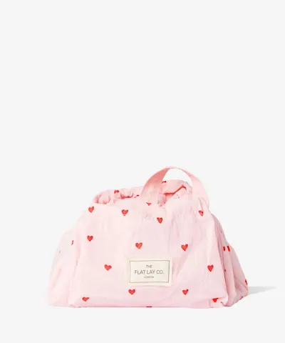 The Flat Lay Co. - Drawstring Makeup Bag in Sweet Pink Hearts Parachute