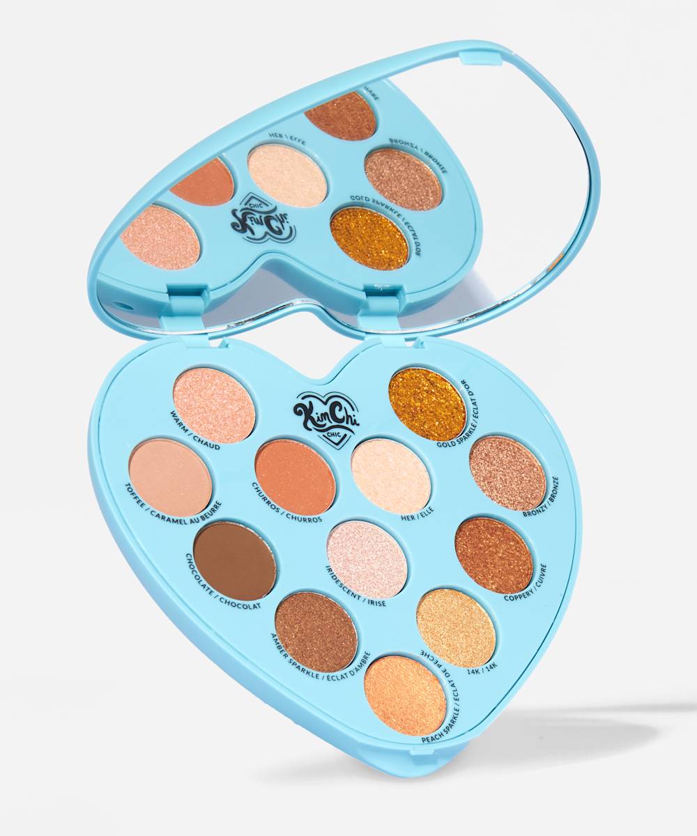blue heart shaped eyeshadow palette with brown shades and a mirror